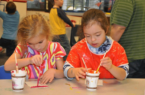 two children painting a picture